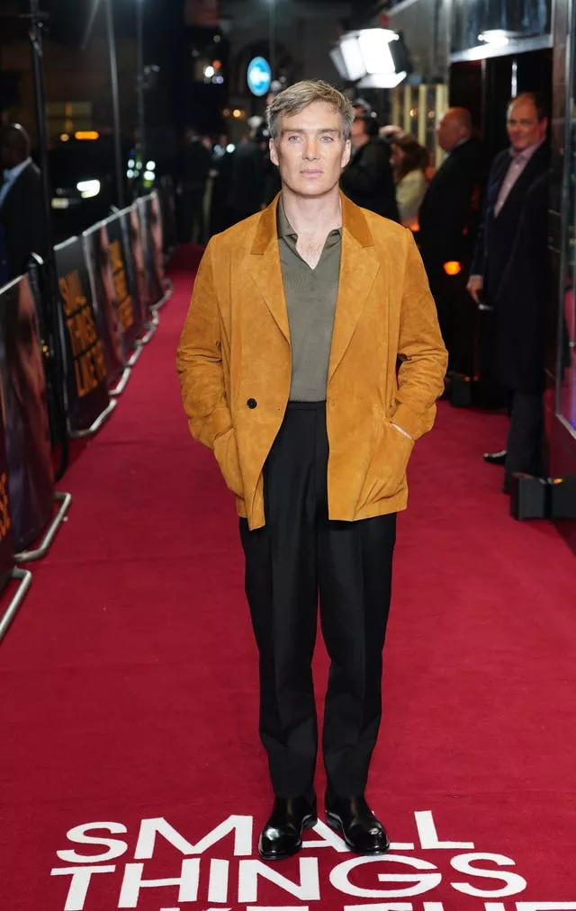 Cillian Murphy wearing a mustard-coloured jacket, complemented by a khaki shirt and a lighter hair colour, containing flecks of blonde, grey and dark brown