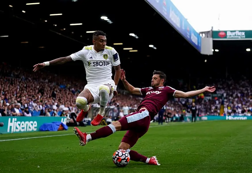 Aaron Cresswell, right, could be back for West Ham in north London (Zac Goodwin/PA)