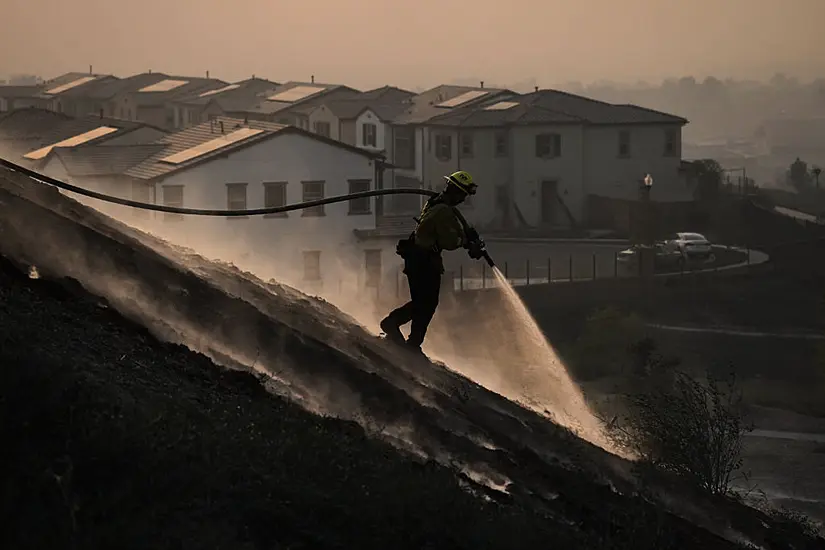 Tens Of Thousands Evacuated As Crews Battle California Wildfires