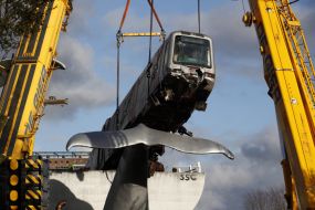 Cranes Lift Runaway Train Off Whale Sculpture In Rotterdam