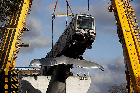 Cranes Lift Runaway Train Off Whale Sculpture In Rotterdam