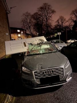 Car Drives Off With Front Door Lodged In Windscreen After Crashing Into House