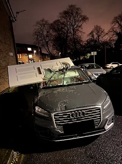 Car Drives Off With Front Door Lodged In Windscreen After Crashing Into House