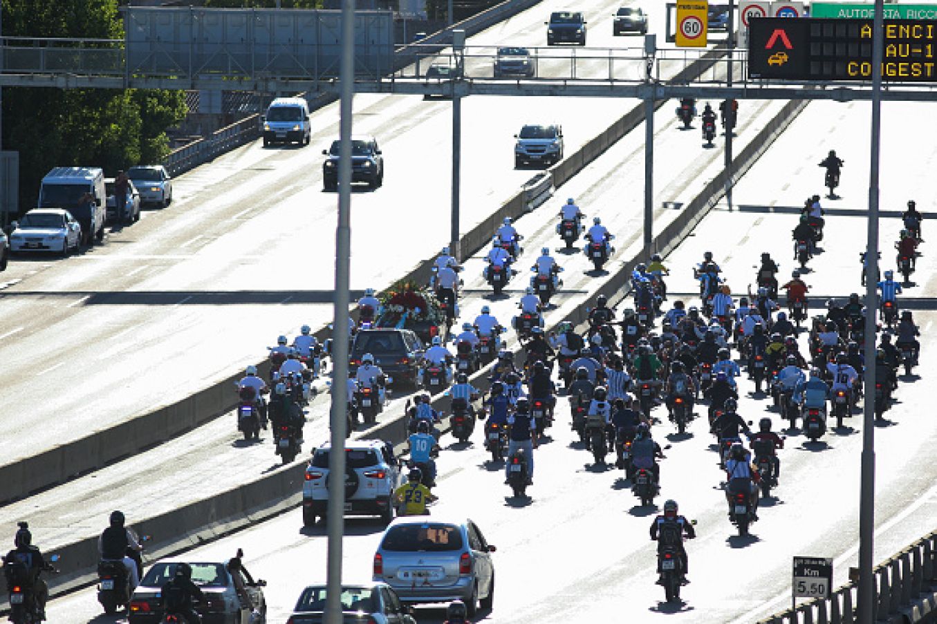 A Large Group Of Motorcyclists Follow The Hearse In Buenos Aires, Argentina. Photo: Roberto Tuero/Getty Images