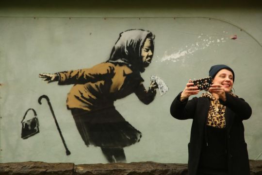 Banksy Mural Of Sneezing Woman Appears On England's Steepest Street