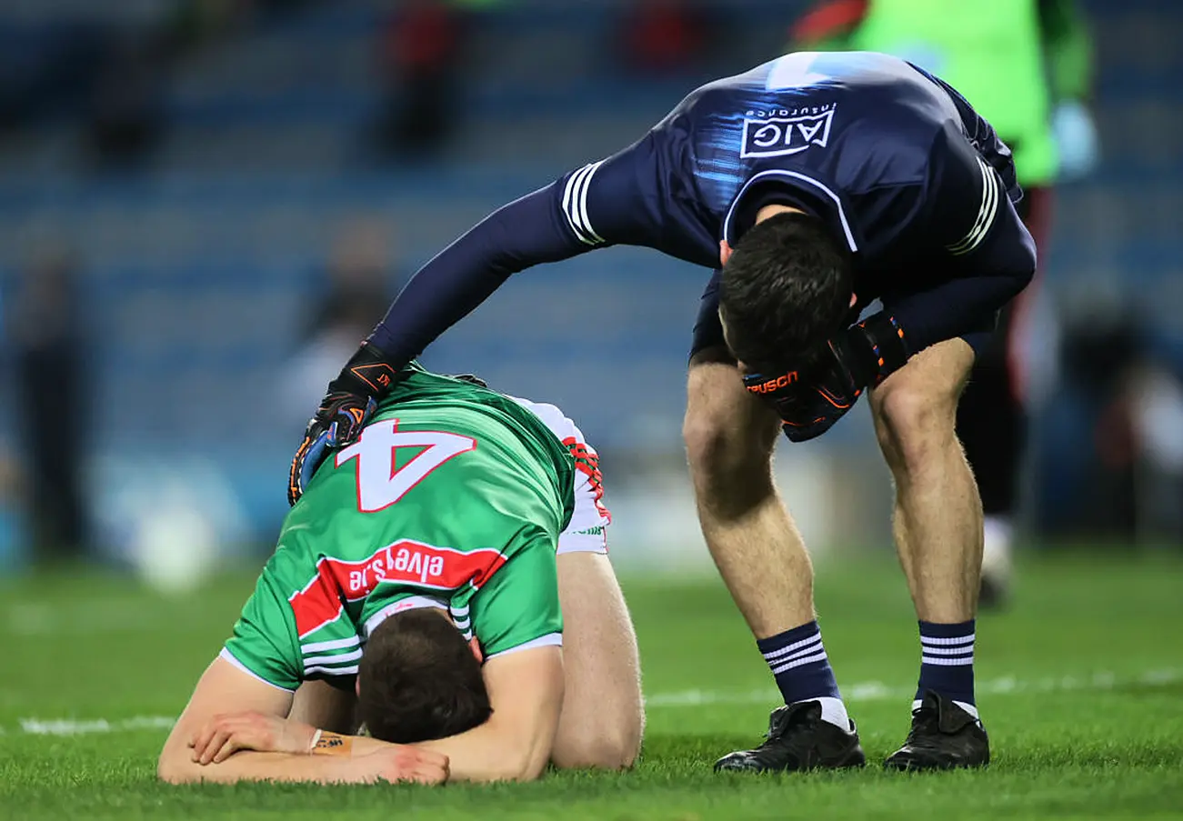 Dublin Captain Stephen Cluxton Checks On Mayo's Lee Keegan. Credit ©Inpho/James Crombie