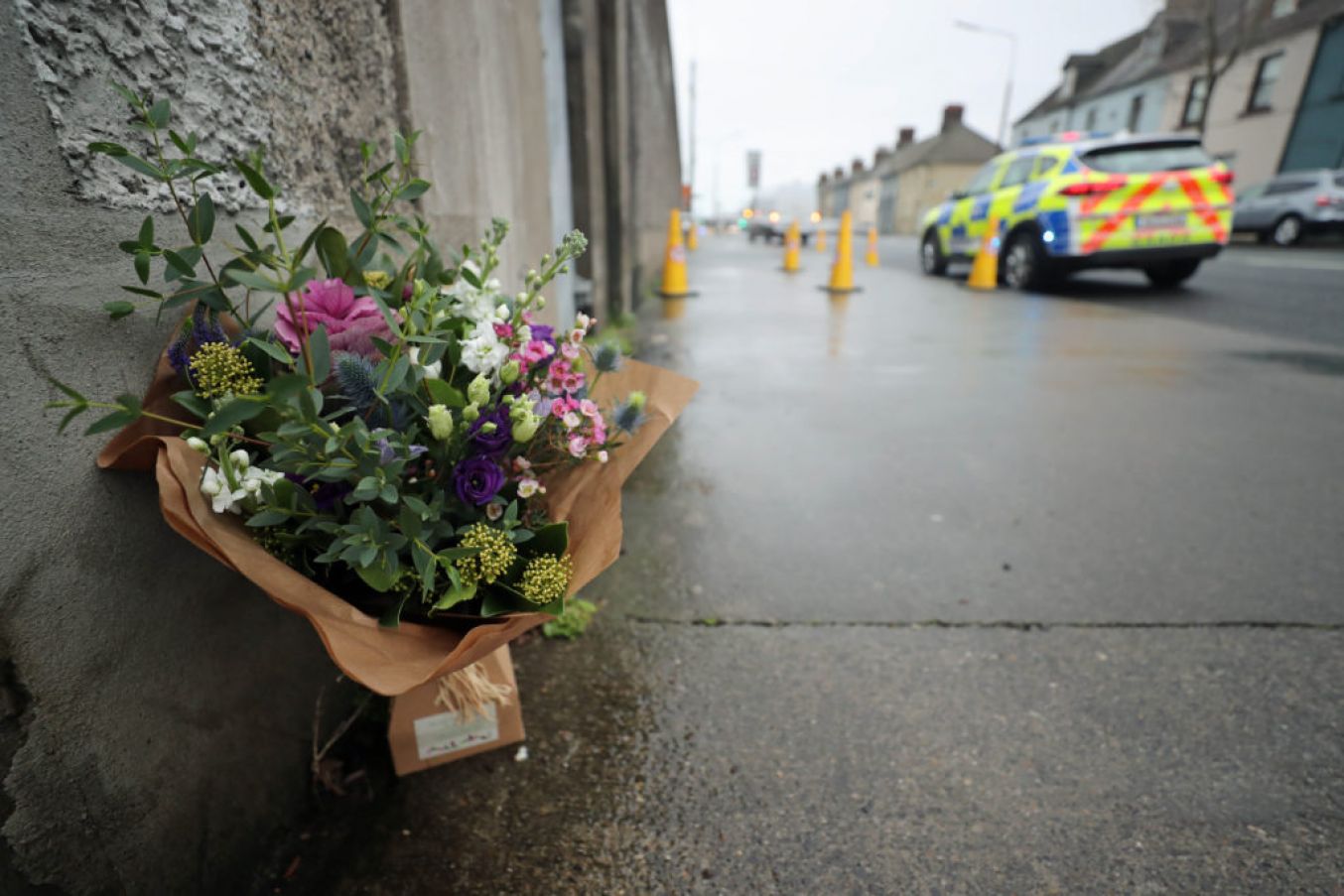 Flowers Left At The Scene On East Wall Road. Photo: Niall Carson/Pa