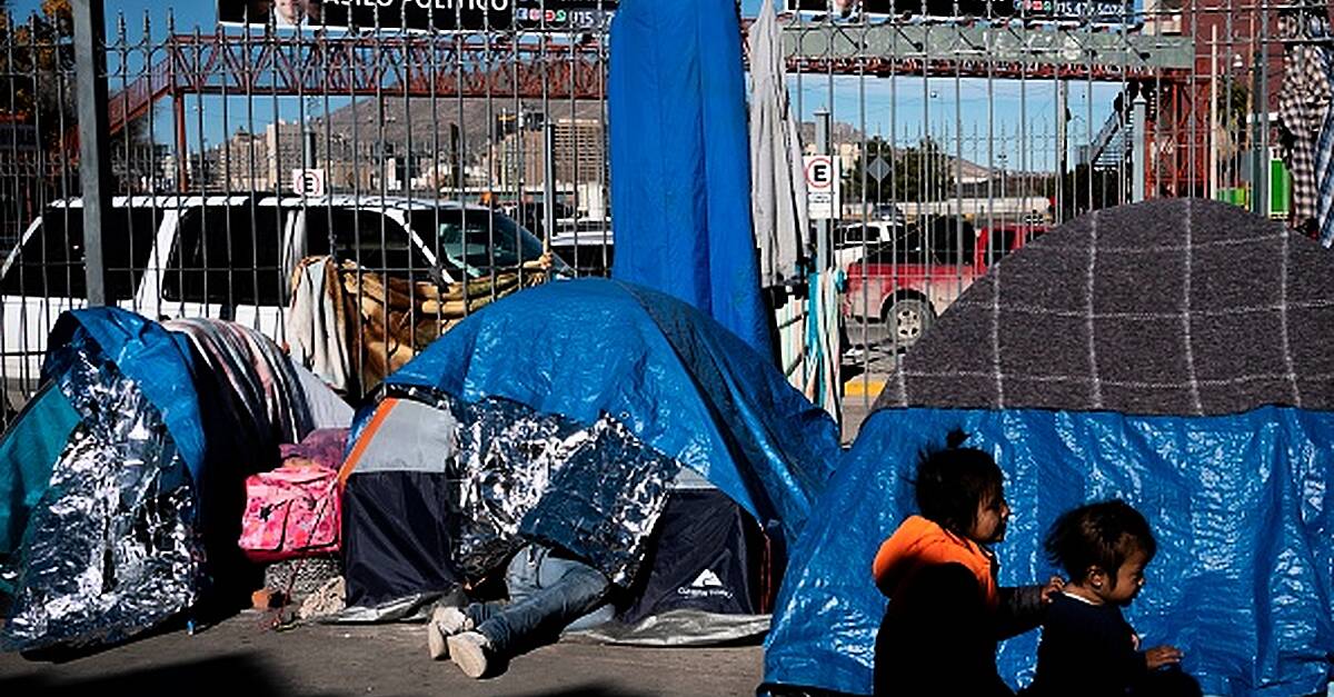 Asylum camp swells at US-Mexico border as Biden aide calls for patience