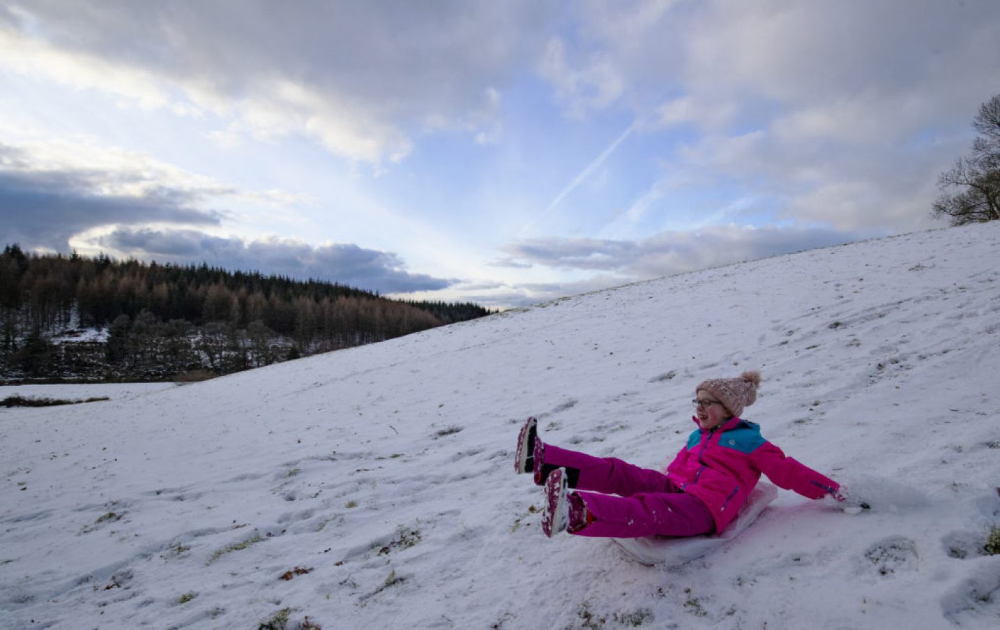 Amy Taggart (7) Uses A Sack To Slide Down A Hill In The Wicklow Mountains. Photo: Pa Images.