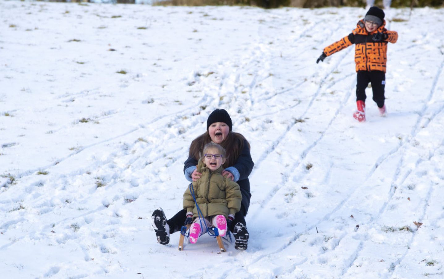 Bonnie Lawrence (4) And Emmie Mills (10) Sled Down A Hill In The Wicklow Mountains. Photo: Pa Images.
