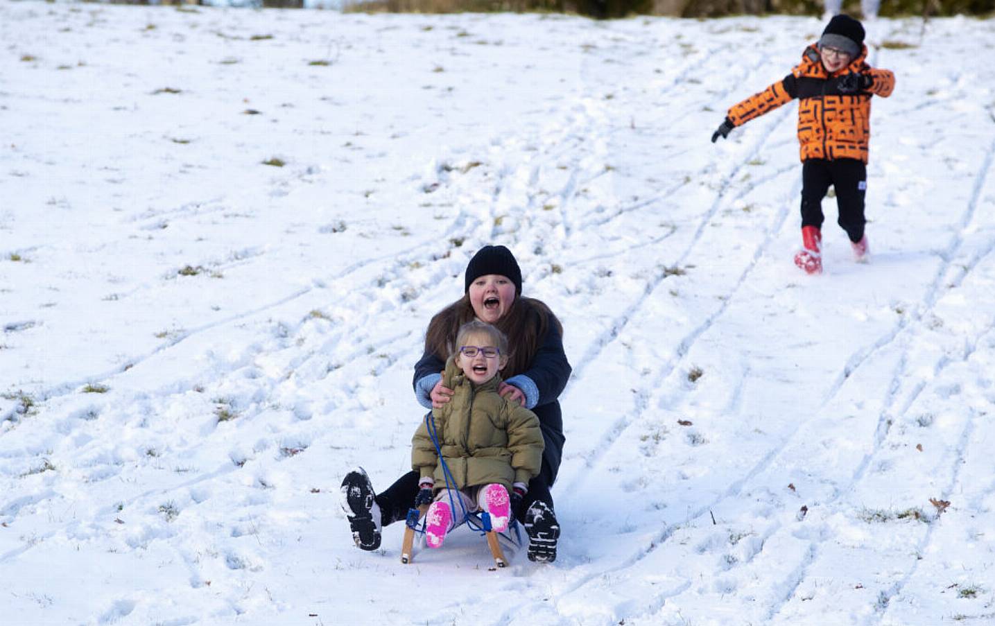 Bonnie Lawrence (4) And Emmie Mills (10) Sled Down A Hill In The Wicklow Mountains. Photo: Pa Images.