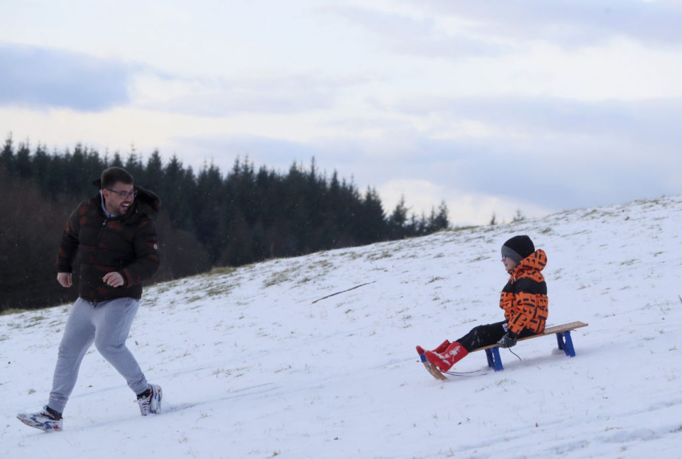 Robbie Mills Supervises Alex Lawrence (8) As He Sleds Down A Hill In The Wicklow Mountains. Photo: Pa Images.