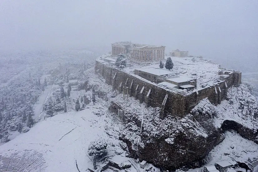 Rare Snow Blankets Acropolis In Athens