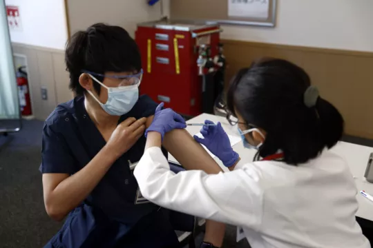 Japan Begins Vaccine Drive Amid Uncertainty Over Olympics