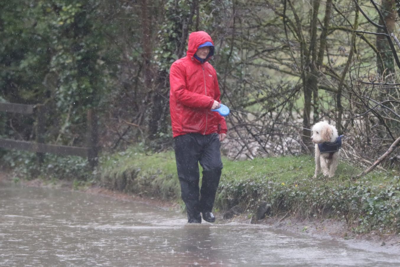 A Man Walks Through Flood Water In Mallow. Photo: Niall Carson Pa