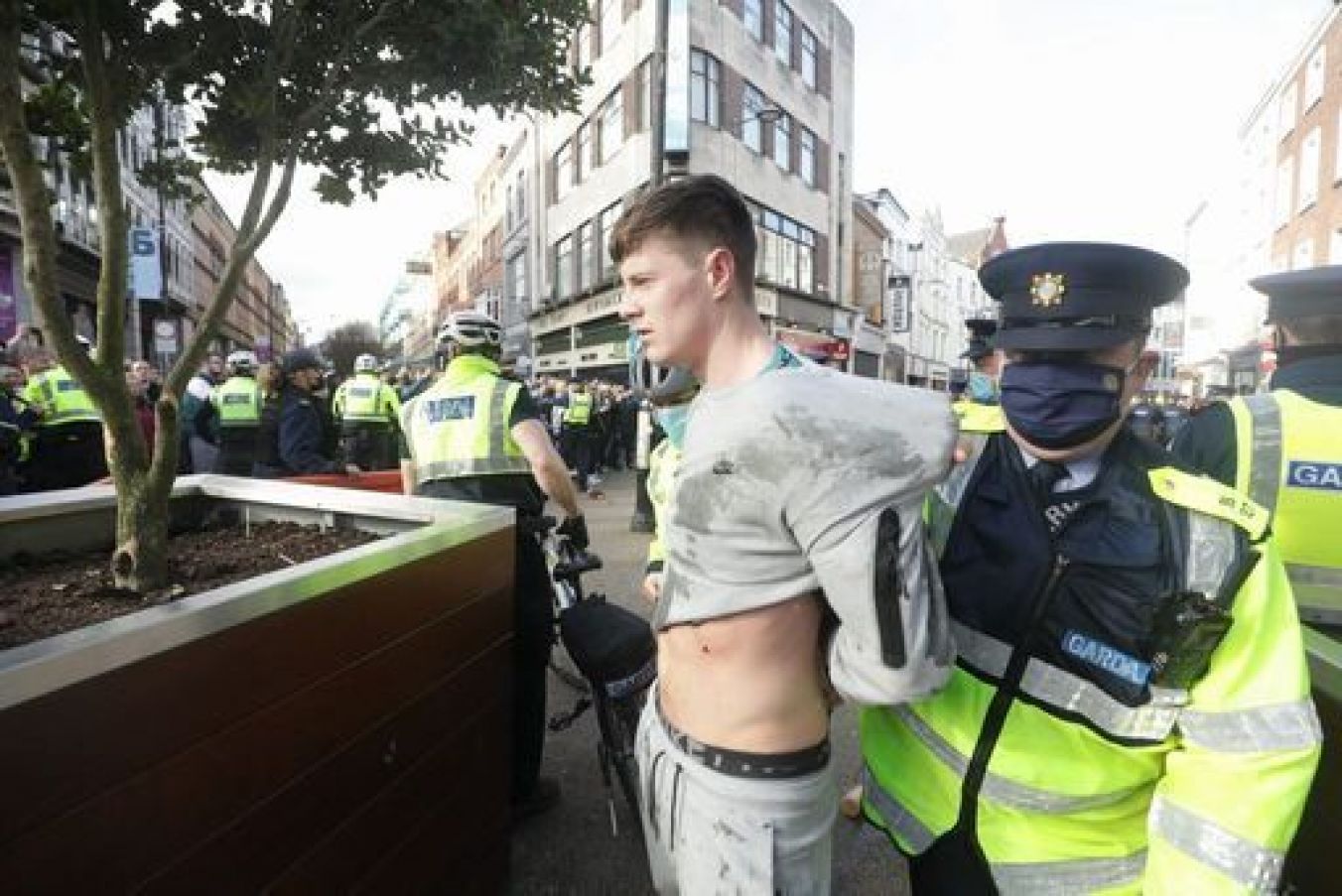 Gardai Restrain A Protester Dring An Anti-Lockdown Protest In Dublin City Centre.