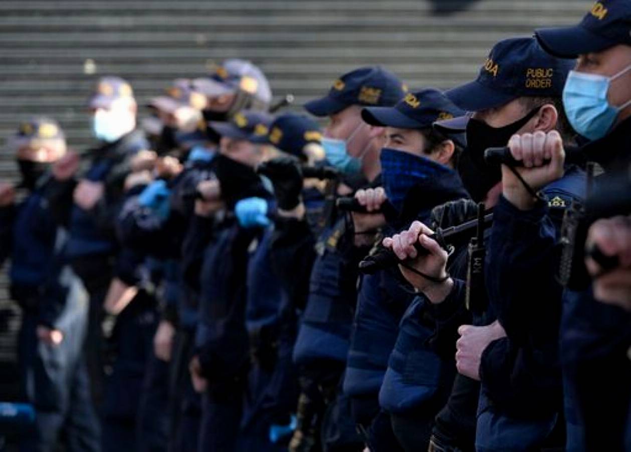 A Line Of Garda Officers In Front Of Anti-Lockdown Protesters On Grafton Street, Dublin, During Level 5 Covid-19 Lockdown. On Saturday, Fabruary 27, 2021, In Dublin, Ireland. (Photo By Artur Widak/Nurphoto)