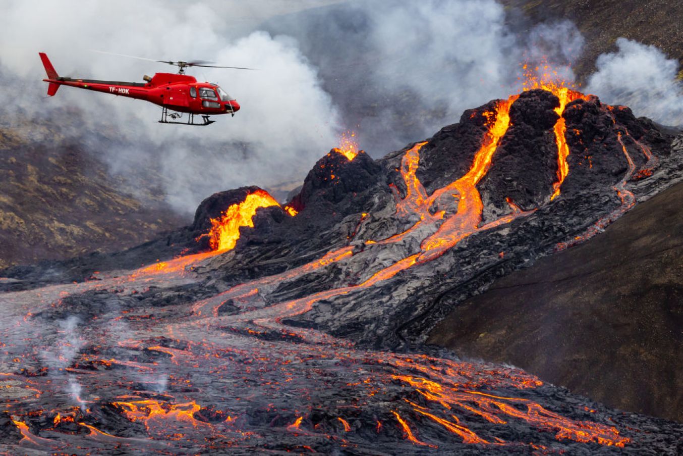 A Helicopter Flies Close To The Eruption. (Photo By Vilhelm Gunnarsson/Getty Images)