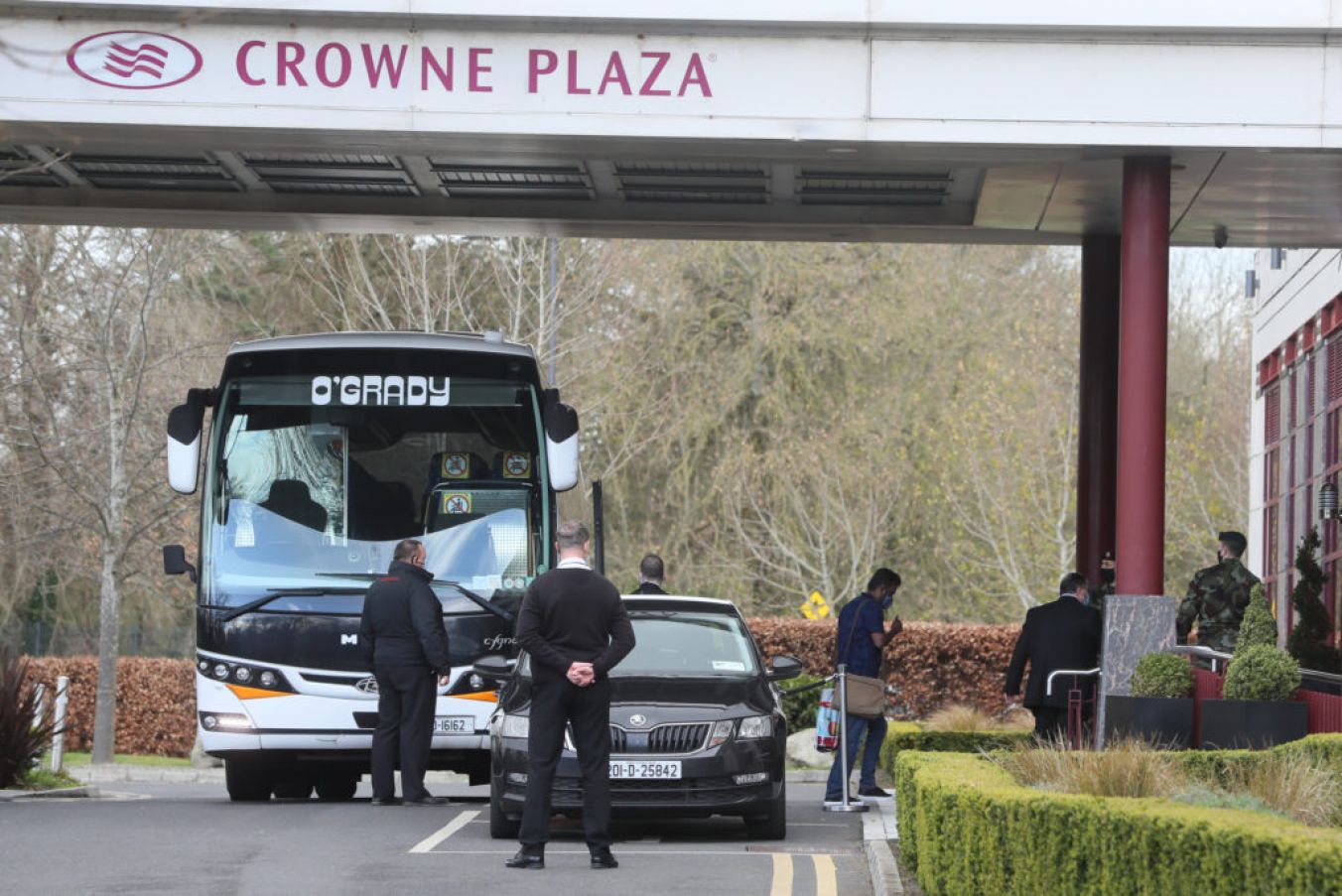 Travellers Leave A Bus Outside The Crowne Plaza Hotel, Santry, Near Dublin Airport. Photo: Pa Images.