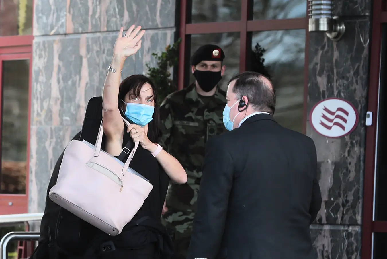 A Traveller Waves As She Enters The Crowne Plaza Hotel, Santry, Near Dublin Airport. Photo: Pa Images.
