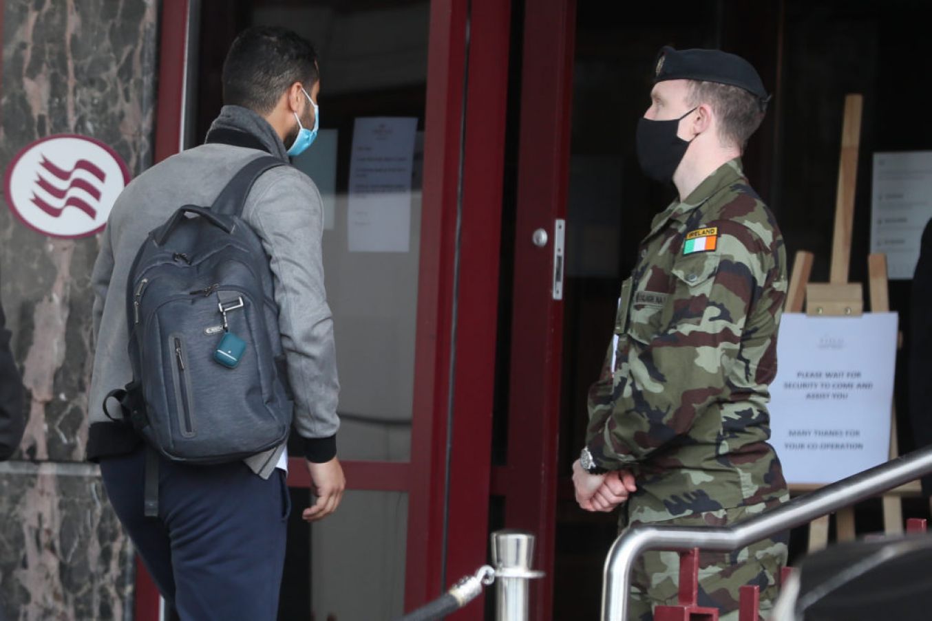 A Traveller Enters The Crowne Plaza Hotel, Santry, Near Dublin Airport, Where He Will Stay During A Mandatory 12-Day Quarantine. Photo: Pa Images.