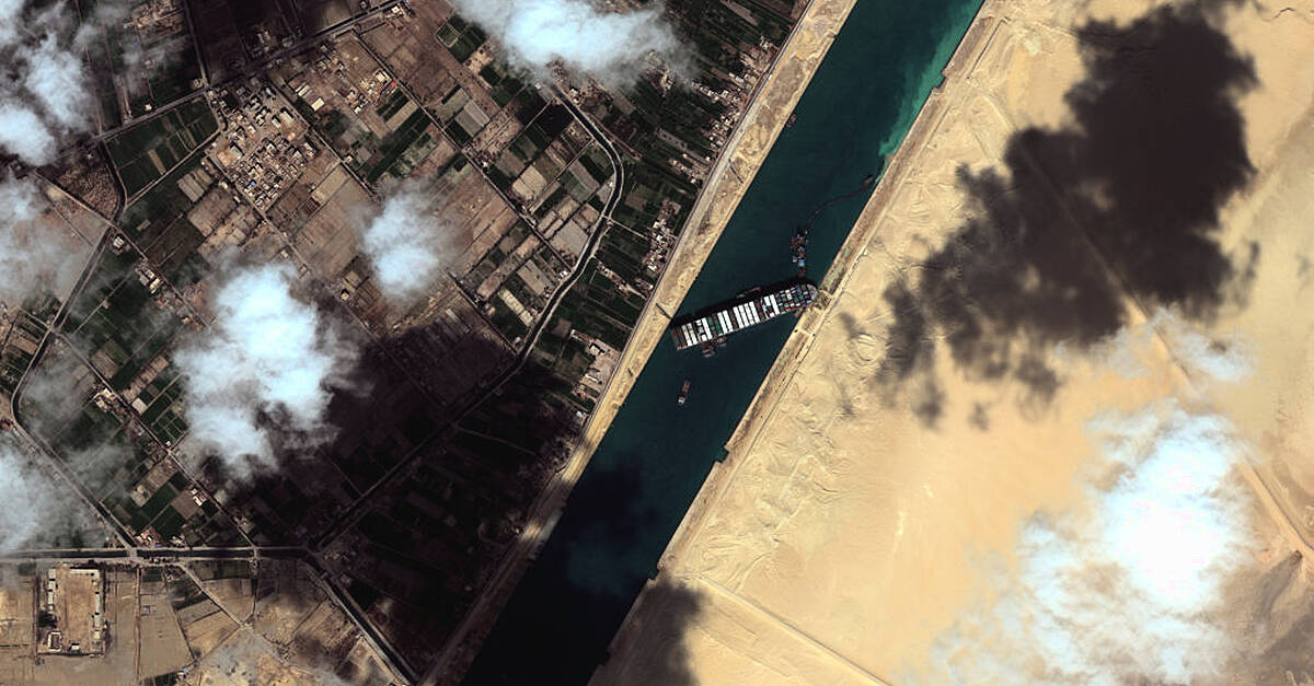 Two more tugboats join bid to free cargo ship stuck in Suez Canal