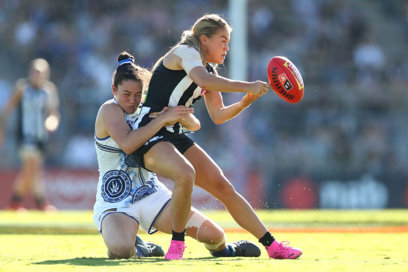 Sarah Rowe (Mayo) Handballs As She Is Tackled By Danielle Hardiman During A Meeting Of The Collingwood Magpies And The North Melbourne Kangaroos. (Photo By Kelly Defina/Afl Photos/Via Getty Images)
