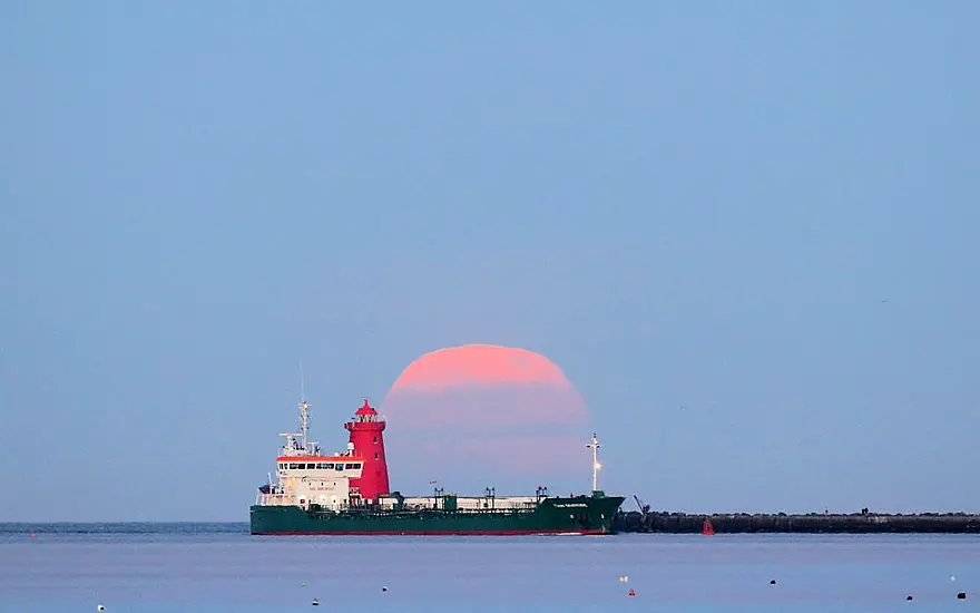 Pink Supermoon Lights Up The Dawn Skies