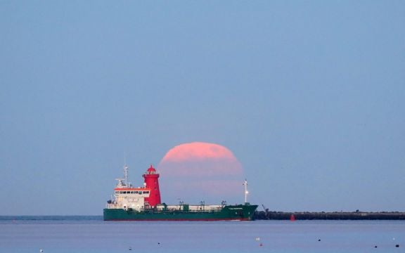 Pink Supermoon Lights Up The Dawn Skies