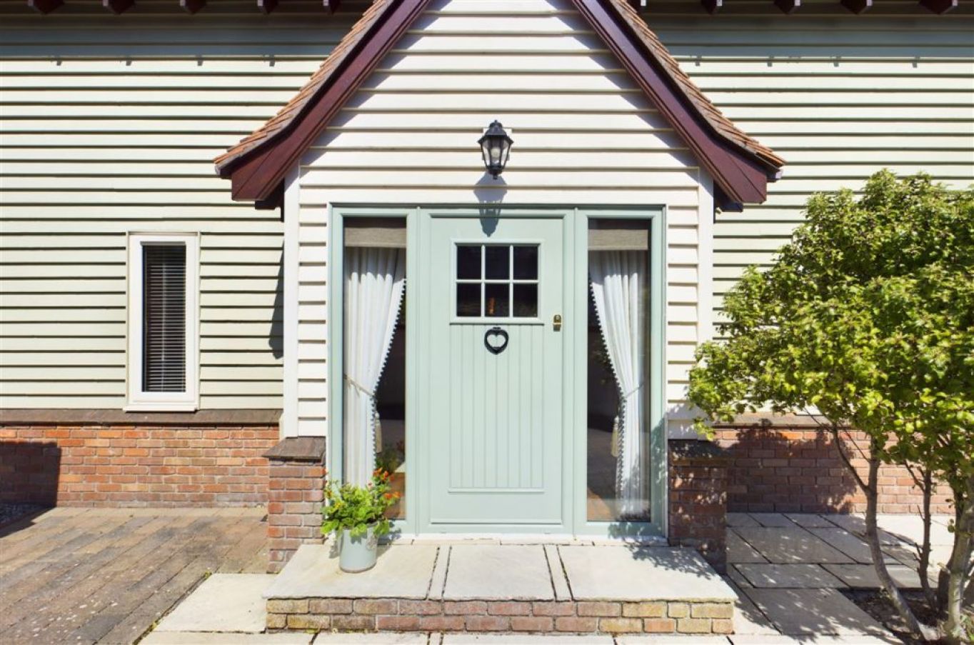 Entry To The House, Built In 2005, Is Through A Cottage-Style Front Porch. Photo: Courtesy Of Re/Max Property Specialists.