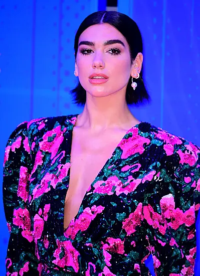 Dua Lipa Gives Nod To Amy Winehouse On Brit Awards Red Carpet