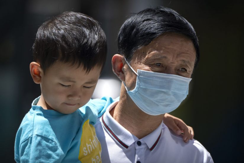 Chinese City Locks Down Neighbourhood Amid Virus Surge