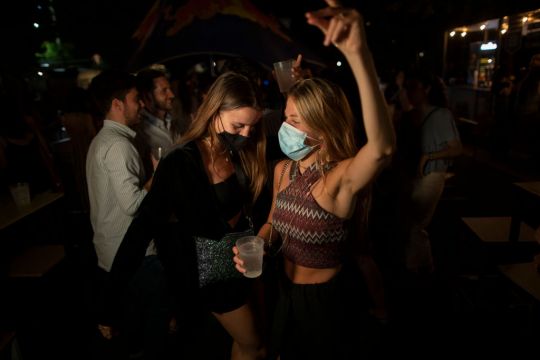 Spain Scraps Outdoor Mask Rule, But Many Stay Covered Up