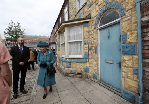 Britain's Queen Pays Visit To Set Of Coronation Street