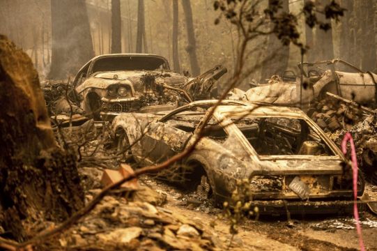 Western Wildfires Calm Down In Cool Weather, But Losses Grow