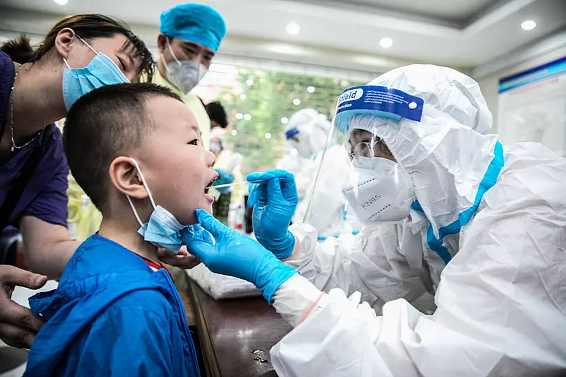 China Keeps Guard Up As Covid Outbreak Enters Fourth Week