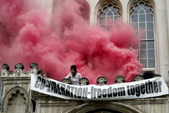 Extinction Rebellion Protesters Spray Red Paint After Scaling London's Guildhall Entrance