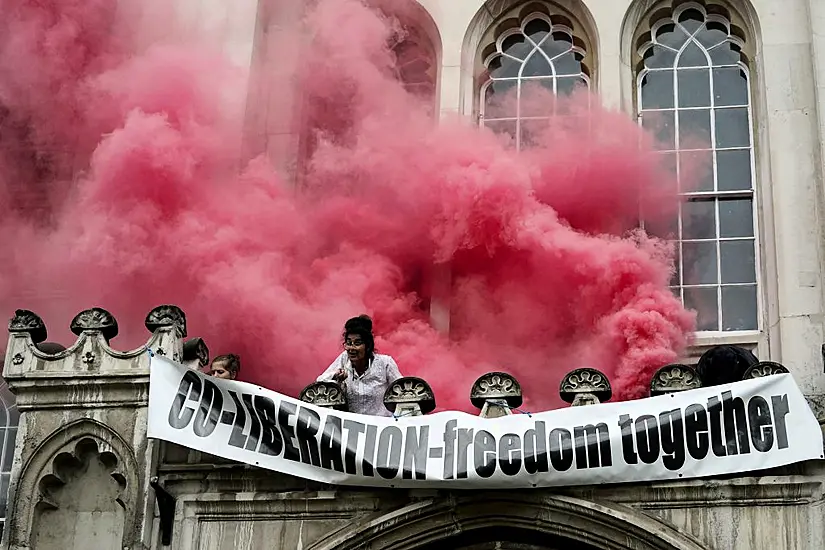 Extinction Rebellion Protesters Spray Red Paint After Scaling London's Guildhall Entrance