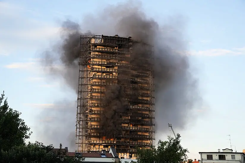 Fire Crews Battle Blaze At Residential Tower Block In Italy