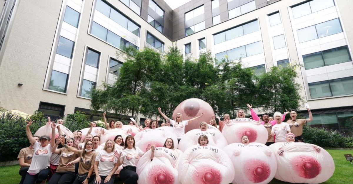 Protesters dressed as giant breasts march outside Facebook's London office