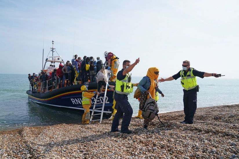 Baby Strapped To Woman Among Migrants Making English Channel Crossing