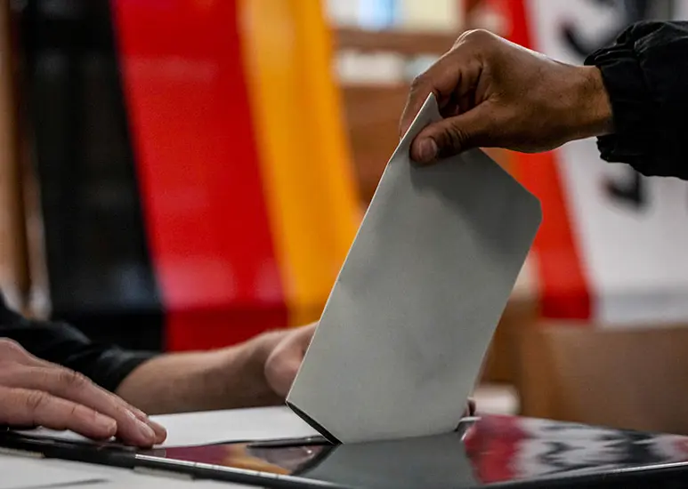 Exit Polls Suggest German Election Rivals Neck-And-Neck