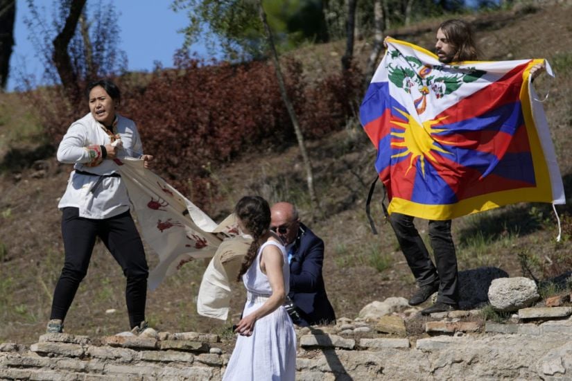 Protesters Denounce China At Winter Olympics Flame-Kindling Ceremony In Greece