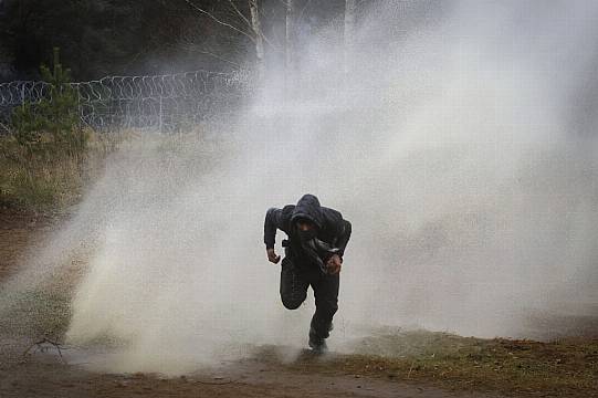 Polish Forces Use Water Cannons On Migrants At Belarus Border