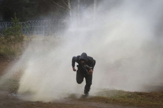 Polish Forces Use Water Cannons On Migrants At Belarus Border