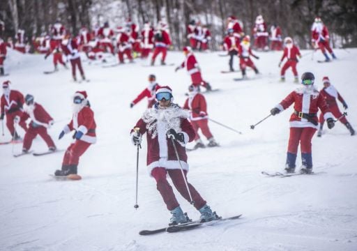 Skiing And Snowboarding Santas Take To The Slopes For Charity