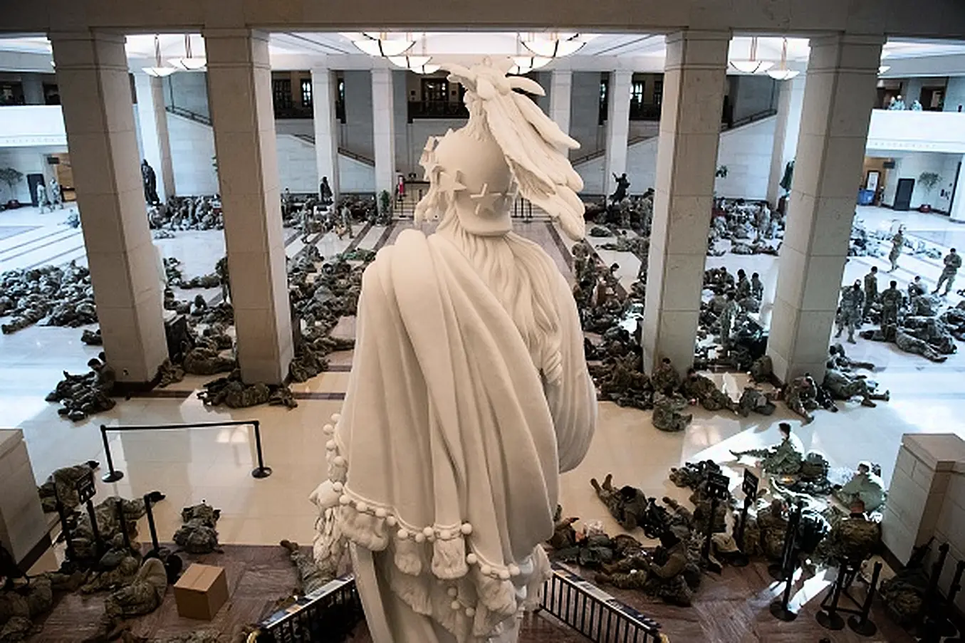 Members Of The Us National Guard Rest In The Capitol Visitors Center On Capitol Hill In Washington Dc Ahead Of An Expected Vote Impeaching Us President Donald Trump. Photo: Saul Loeb Via Getty Images