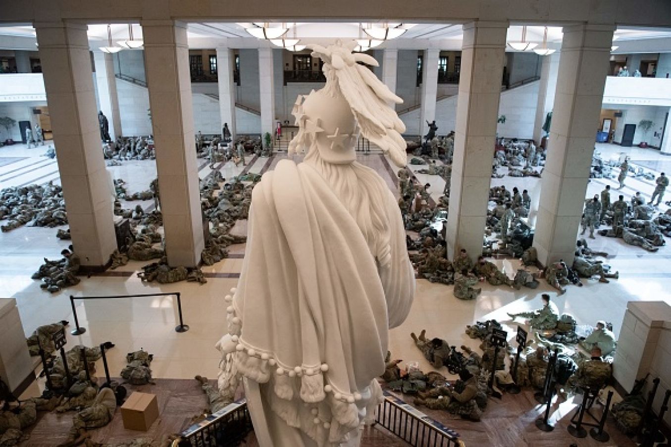 Members Of The Us National Guard Rest In The Capitol Visitors Center On Capitol Hill In Washington Dc Ahead Of An Expected Vote Impeaching Us President Donald Trump. Photo: Saul Loeb Via Getty Images