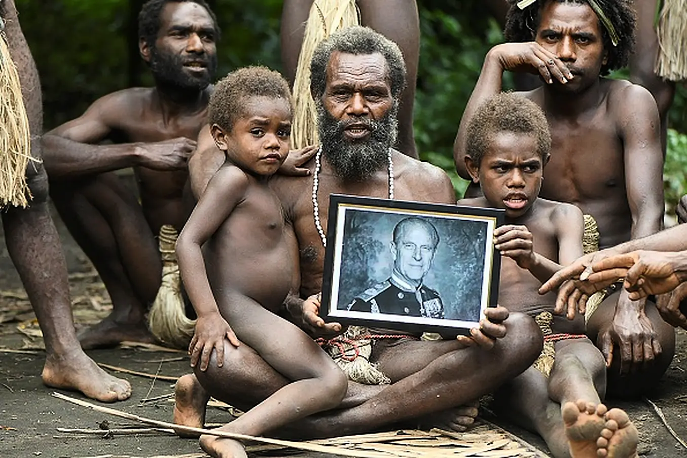 Yakel Village Chief Albi, And Members Of His Family, Holds A Portrait Of Britain's Prince Philip, Duke Of Edinburgh, In The Remote Pacific Village Of Vanuatu. They Worshipped Prince Philip As A Living God. Photo: Dan Mcgarry / Afp Via Getty Images