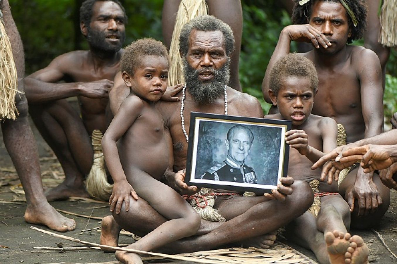 Yakel Village Chief Albi, And Members Of His Family, Holds A Portrait Of Britain's Prince Philip, Duke Of Edinburgh, In The Remote Pacific Village Of Vanuatu. They Worshipped Prince Philip As A Living God. Photo: Dan Mcgarry / Afp Via Getty Images
